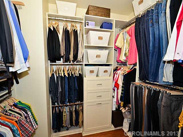7120 Maricopa Road Charlotte, NC 28277 - Photo 10 of 16 a view of walk in closet with clothes and shoes
