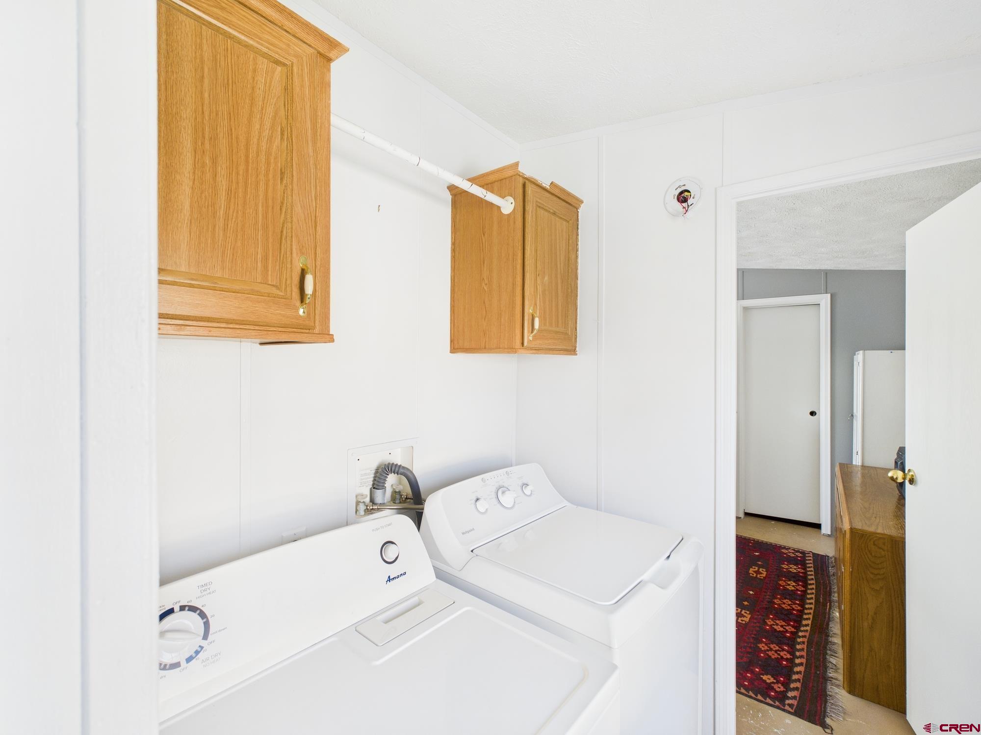 288 Animas View Drive, Unit 9 Durango, CO 81301 - Photo 11 of 20 a utility room with dryer and washer