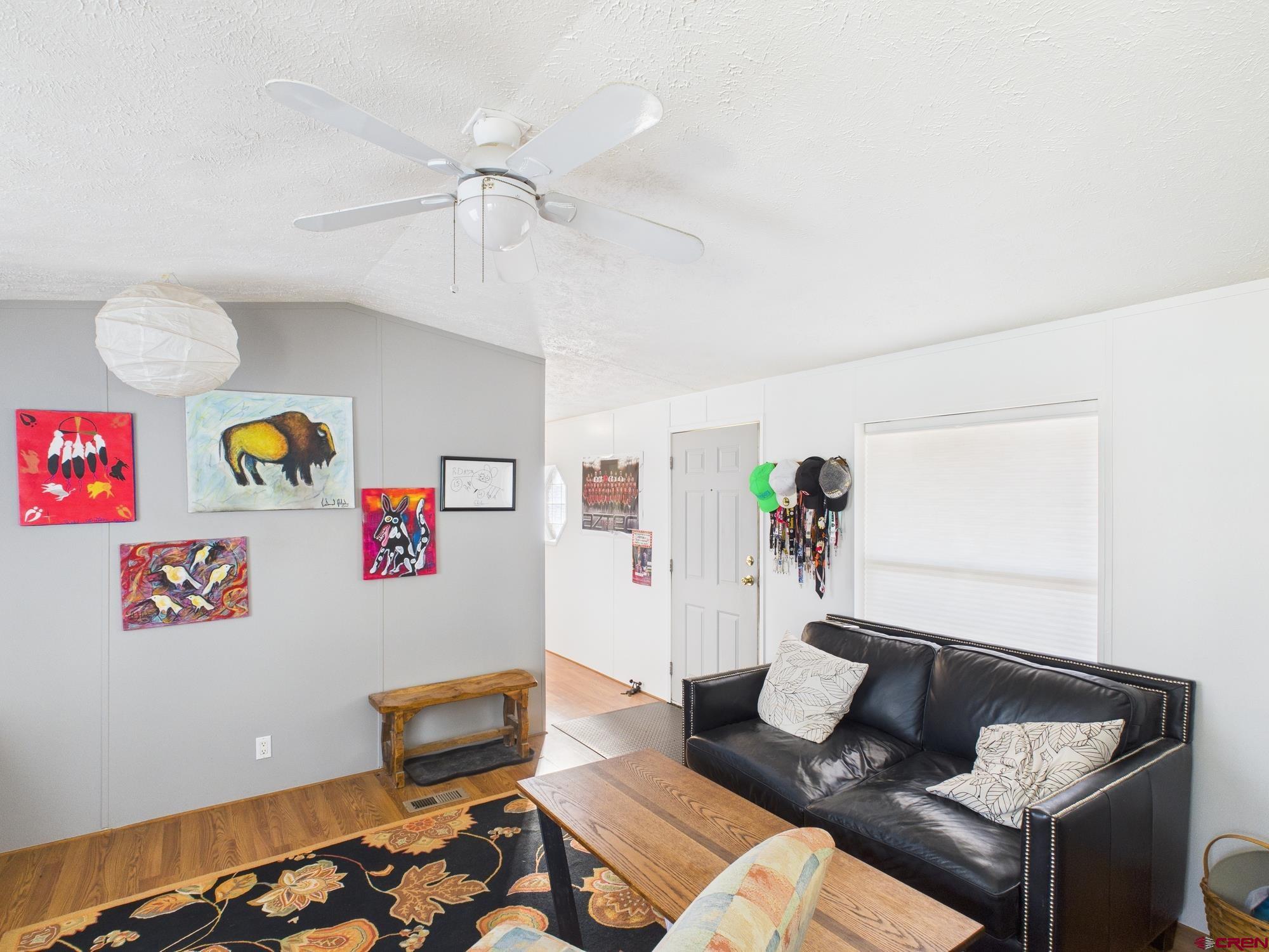 288 Animas View Drive, Unit 9 Durango, CO 81301 - Photo 2 of 20 a living room with furniture and rug