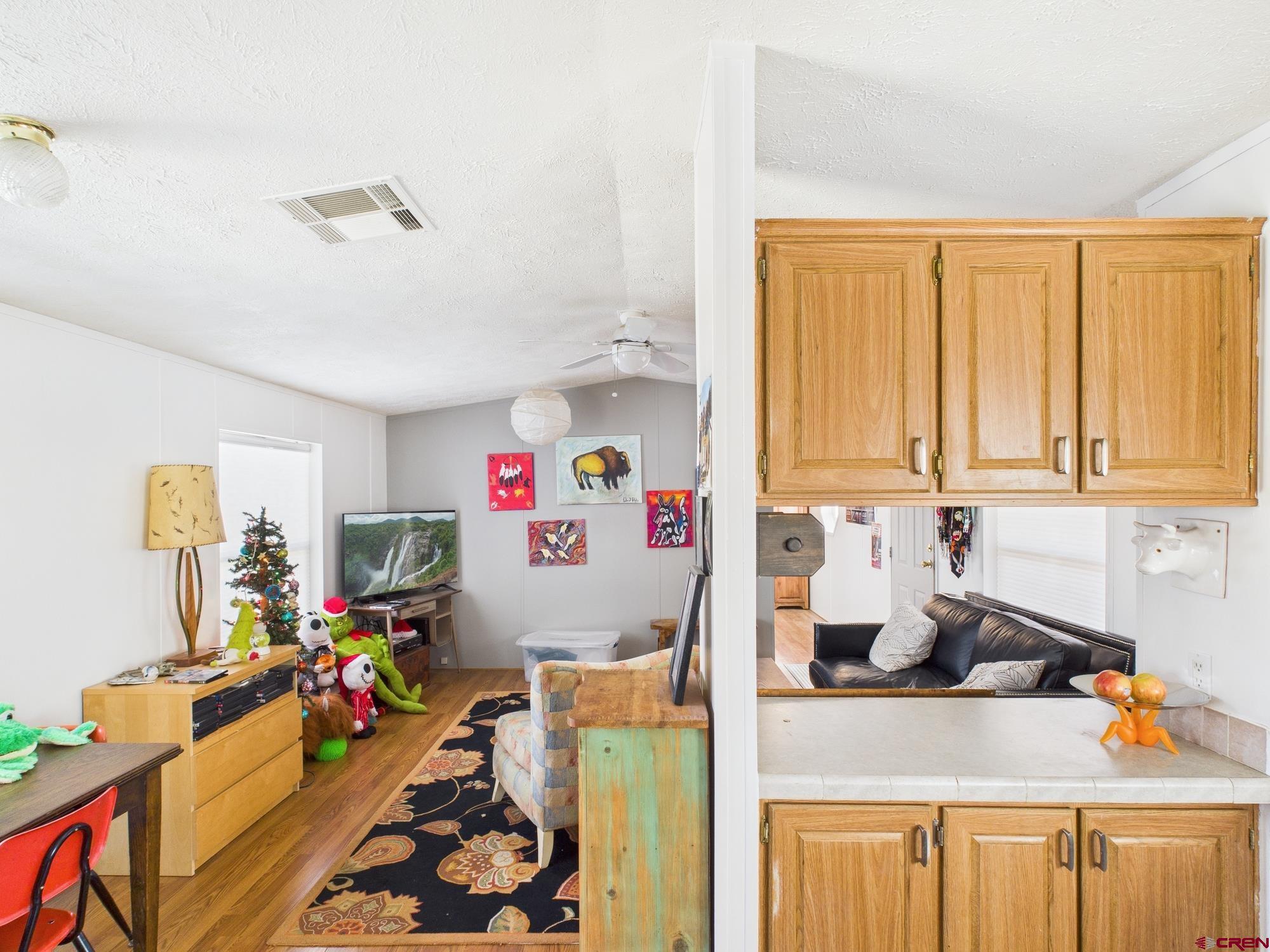 288 Animas View Drive, Unit 9 Durango, CO 81301 - Photo 10 of 20 a view of a kitchen with fridge and window