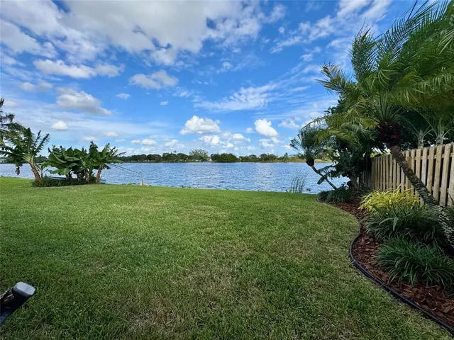 a view of a field with sitting area