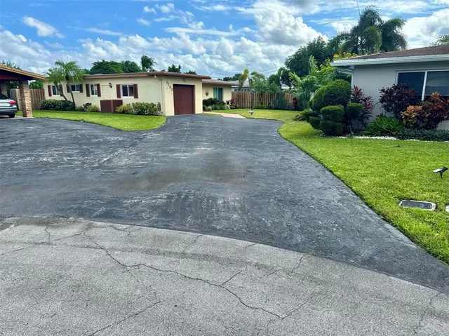 a view of a yard in front of a house