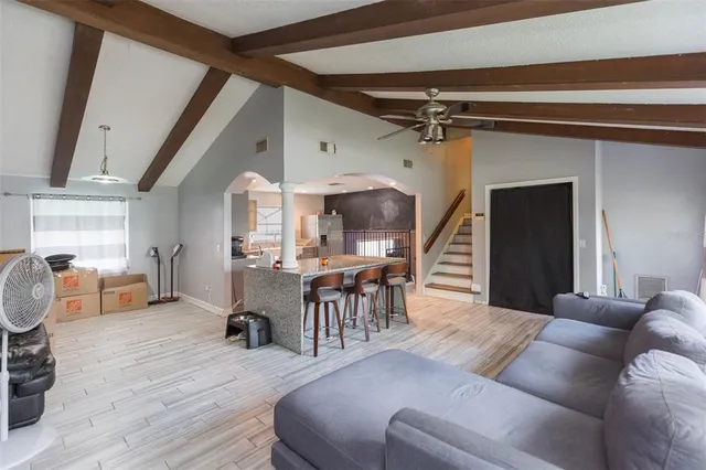 a living room with furniture and a table