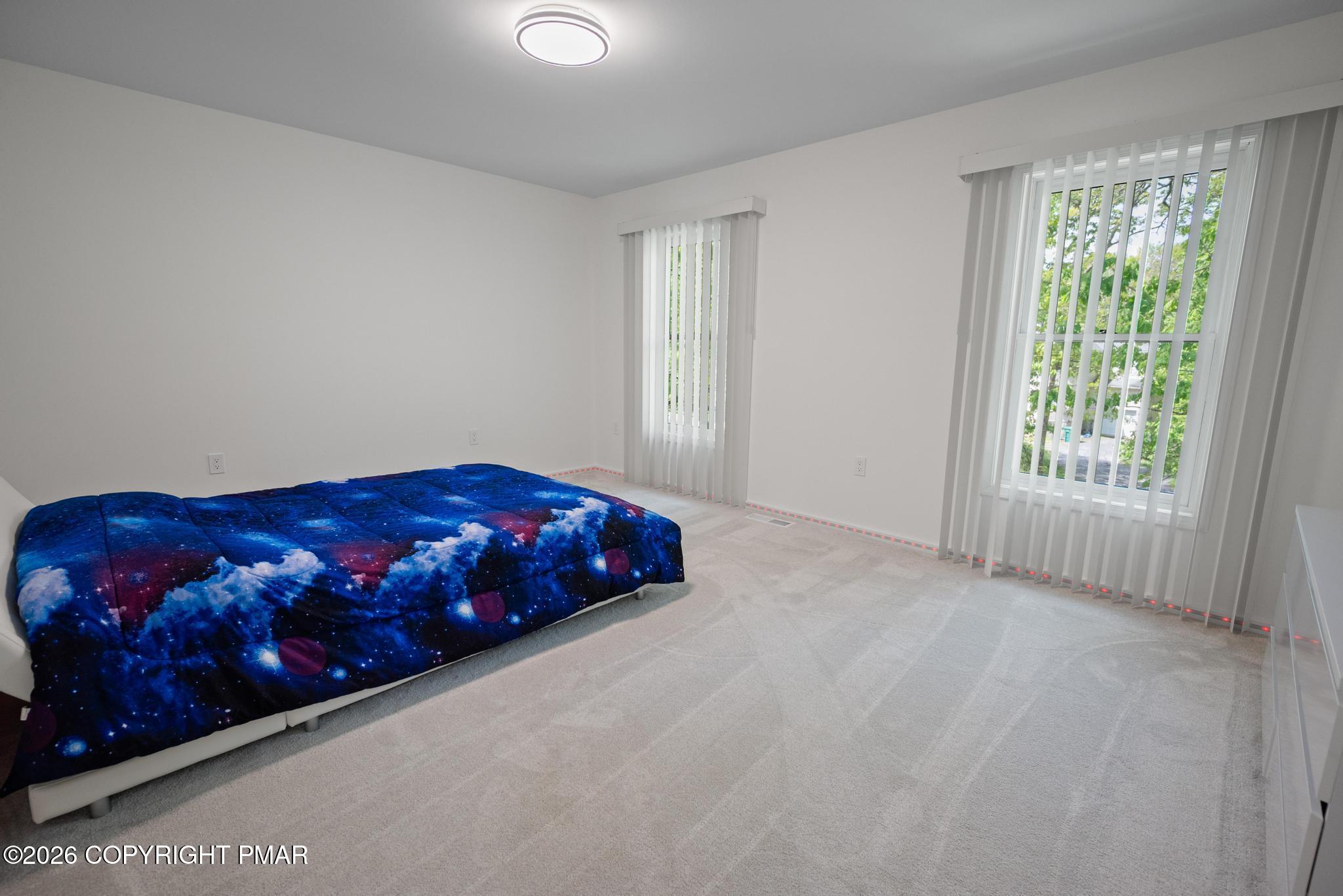 2312 Cramer Court Bushkill, PA 18324 - Photo 27 of 37 a bedroom with a bed and window