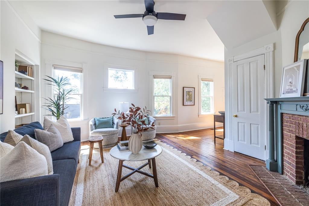532 Broyles Street Southeast Atlanta, GA 30312 - Photo 11 of 37 a living room with fireplace furniture and a wooden floor