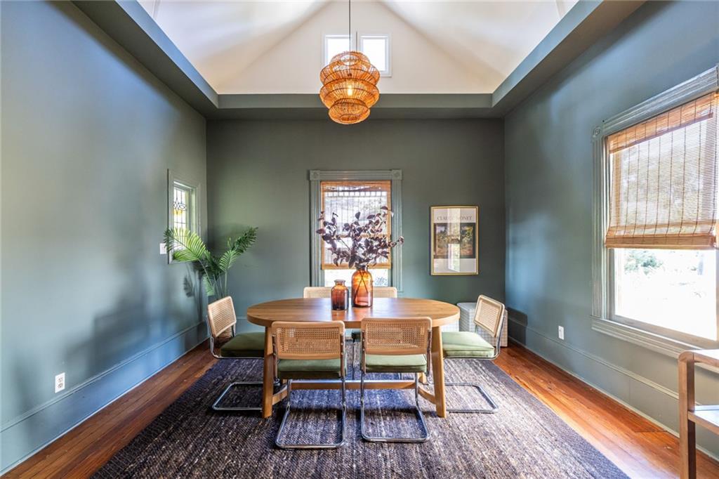 532 Broyles Street Southeast Atlanta, GA 30312 - Photo 13 of 37 a dining room with furniture a rug and a chandelier