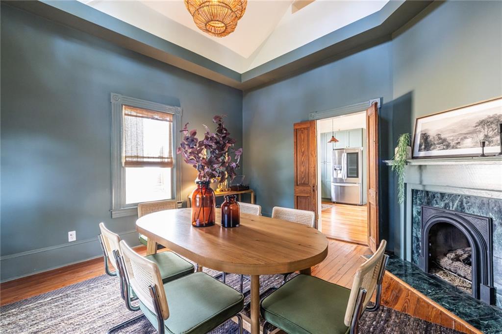 532 Broyles Street Southeast Atlanta, GA 30312 - Photo 15 of 37 a view of a dining room with furniture window and wooden floor