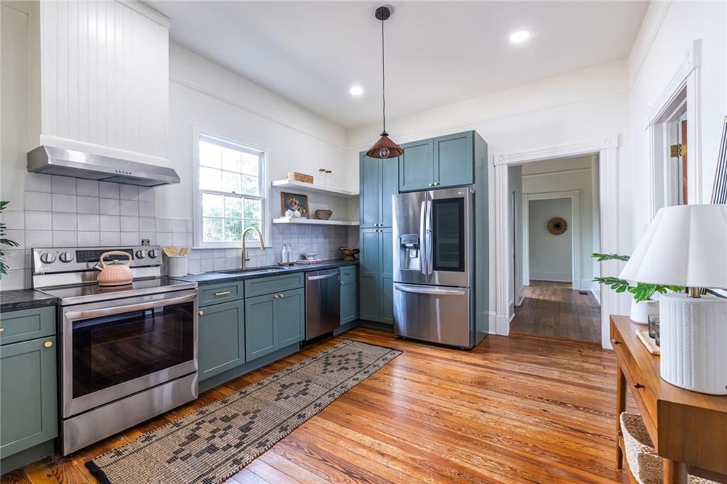 532 Broyles Street Southeast Atlanta, GA 30312 - Photo 17 of 37 a kitchen with a sink stove and refrigerator