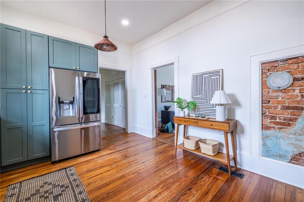 532 Broyles Street Southeast Atlanta, GA 30312 - Photo 19 of 37 a kitchen with stainless steel appliances wooden floor and a refrigerator