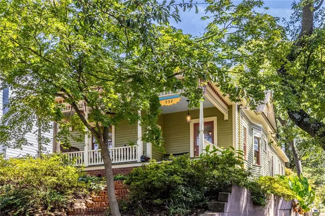 a view of a house with a tree