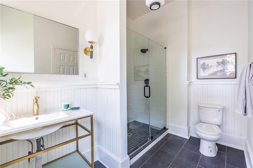532 Broyles Street Southeast Atlanta, GA 30312 - Photo 23 of 37 a bathroom with a sink toilet and shower