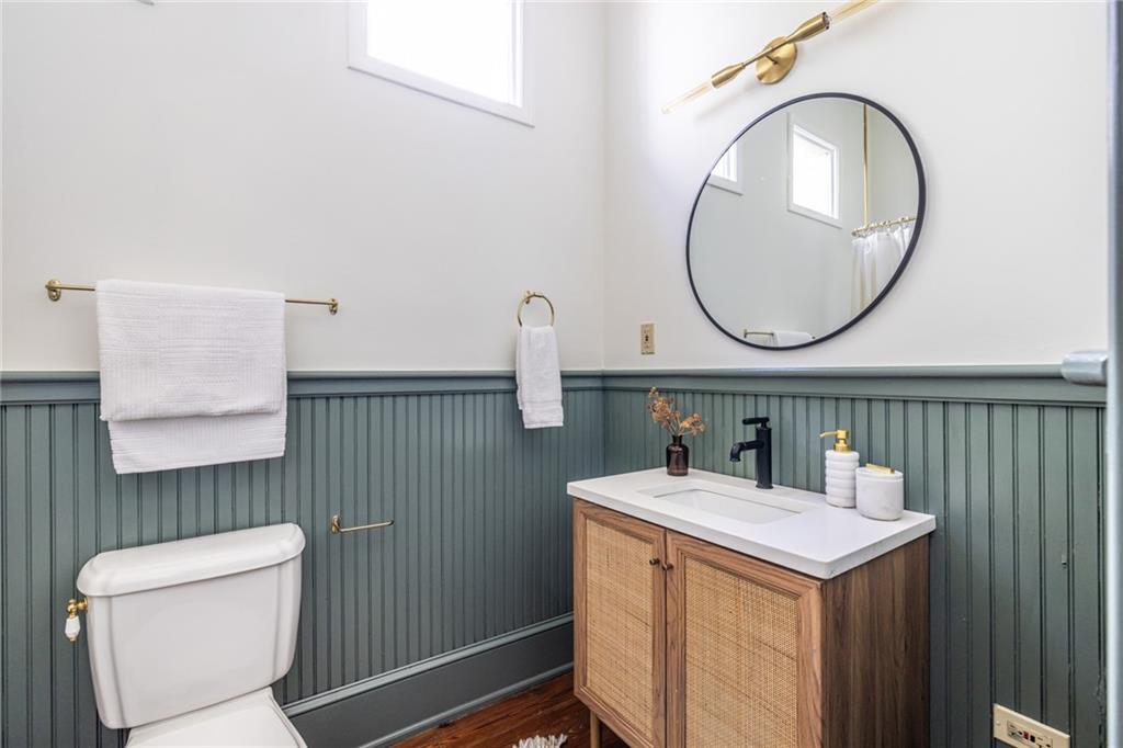 532 Broyles Street Southeast Atlanta, GA 30312 - Photo 28 of 37 a bathroom with a sink a toilet and a mirror