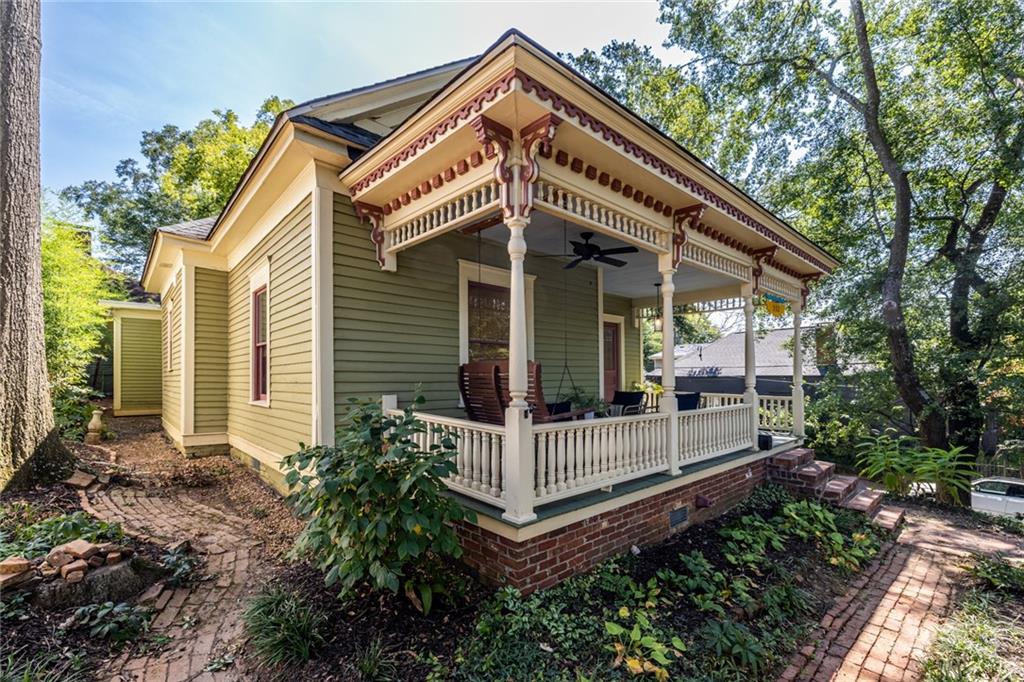 532 Broyles Street Southeast Atlanta, GA 30312 - Photo 33 of 37 a view of a house with large windows and a small yard