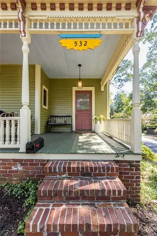 a view of swimming pool with outdoor seating