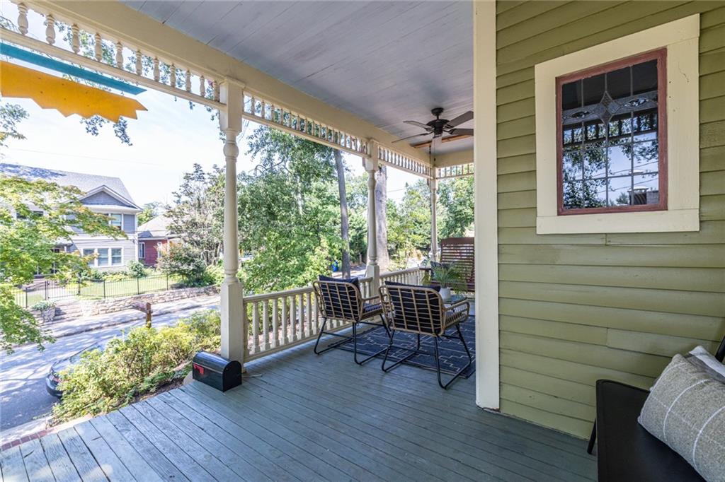 532 Broyles Street Southeast Atlanta, GA 30312 - Photo 36 of 37 a view of a porch with chairs and wooden floor