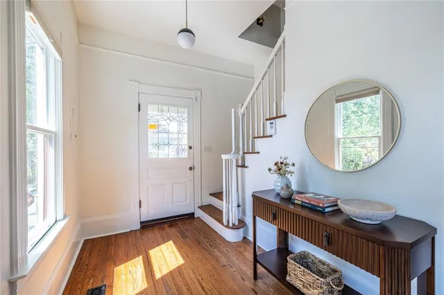 a view of a room with furniture and a window