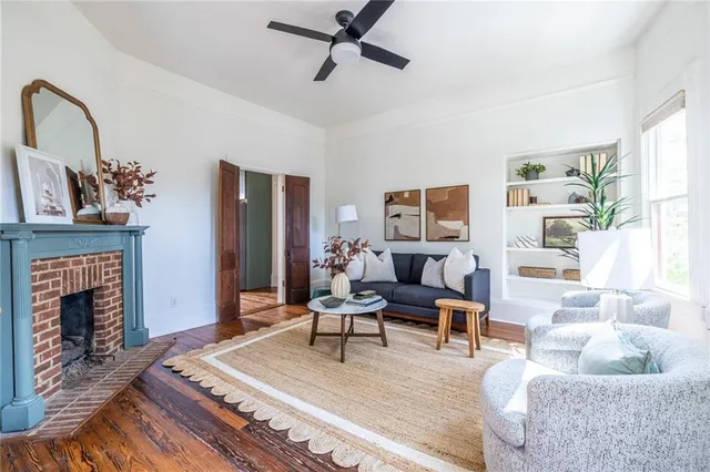 a living room with furniture and a fireplace