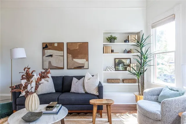 a living room with furniture and a large window