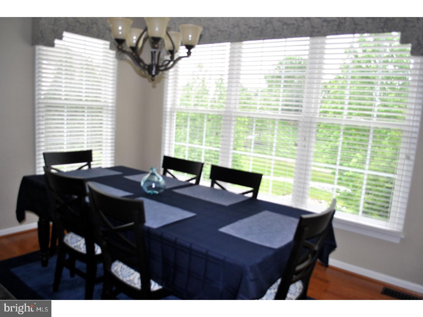 104 Hollins Road Landenberg, PA 19350 - Photo 11 of 17 a view of a dining room with a table and chairs