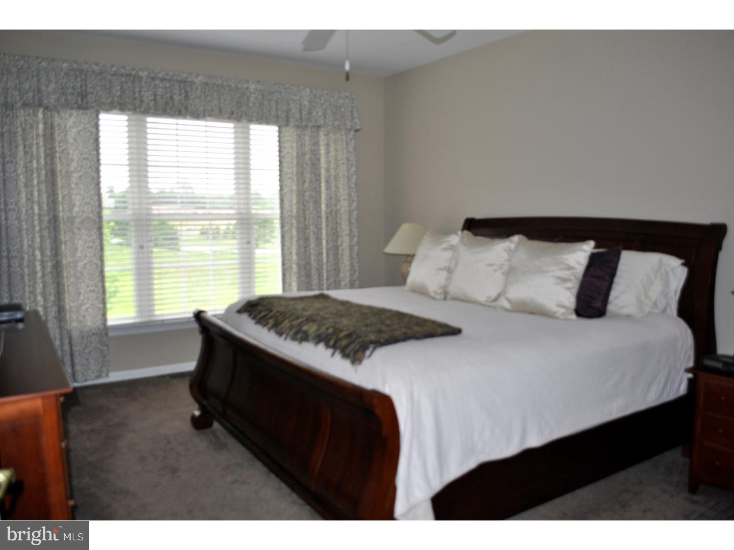 104 Hollins Road Landenberg, PA 19350 - Photo 12 of 17 a bedroom with a bed and a large window