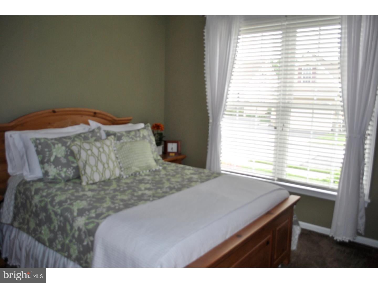 104 Hollins Road Landenberg, PA 19350 - Photo 13 of 17 a bed sitting in a bedroom next to a window