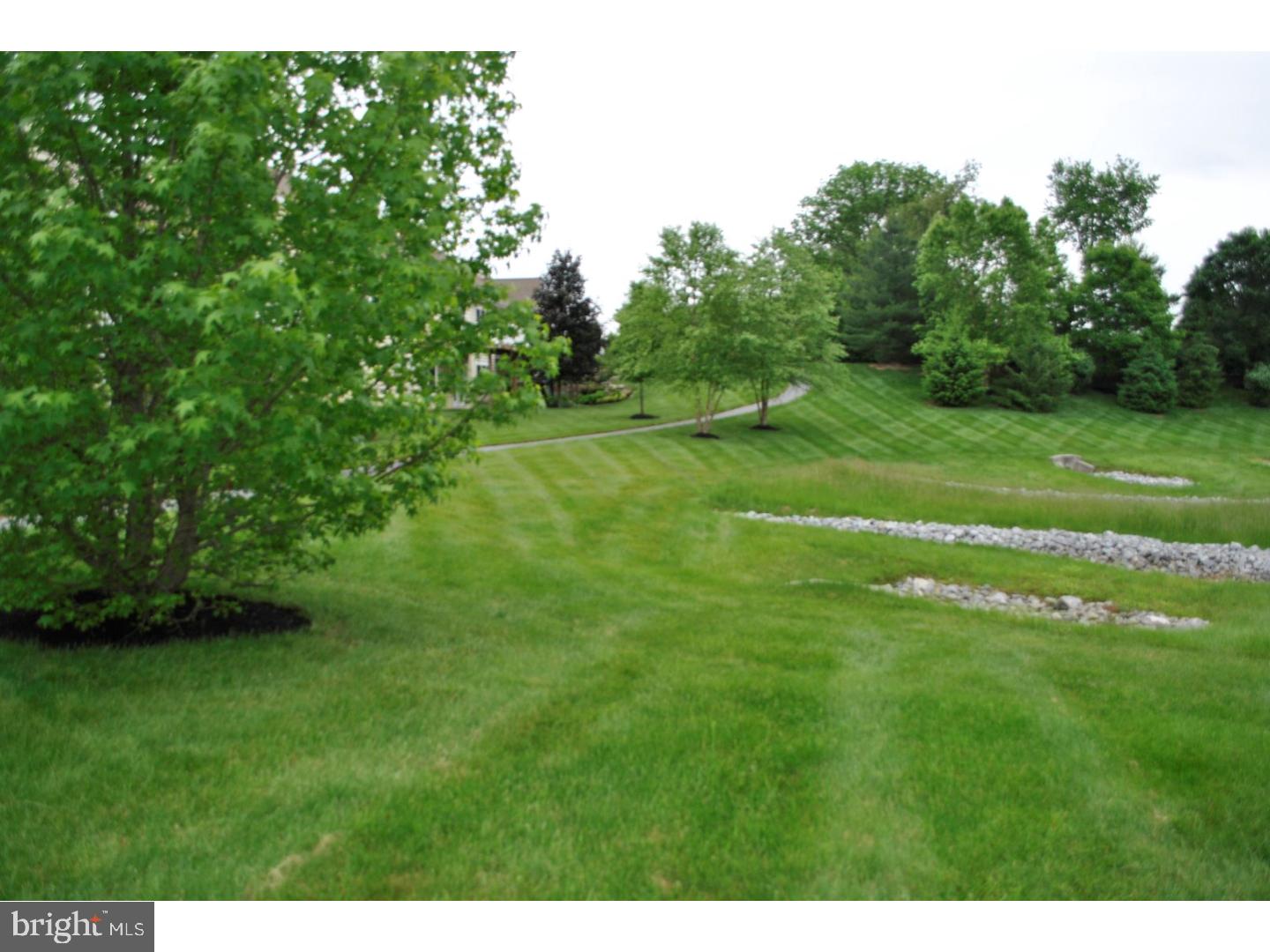 104 Hollins Road Landenberg, PA 19350 - Photo 17 of 17 a backyard of a house with lots of green space
