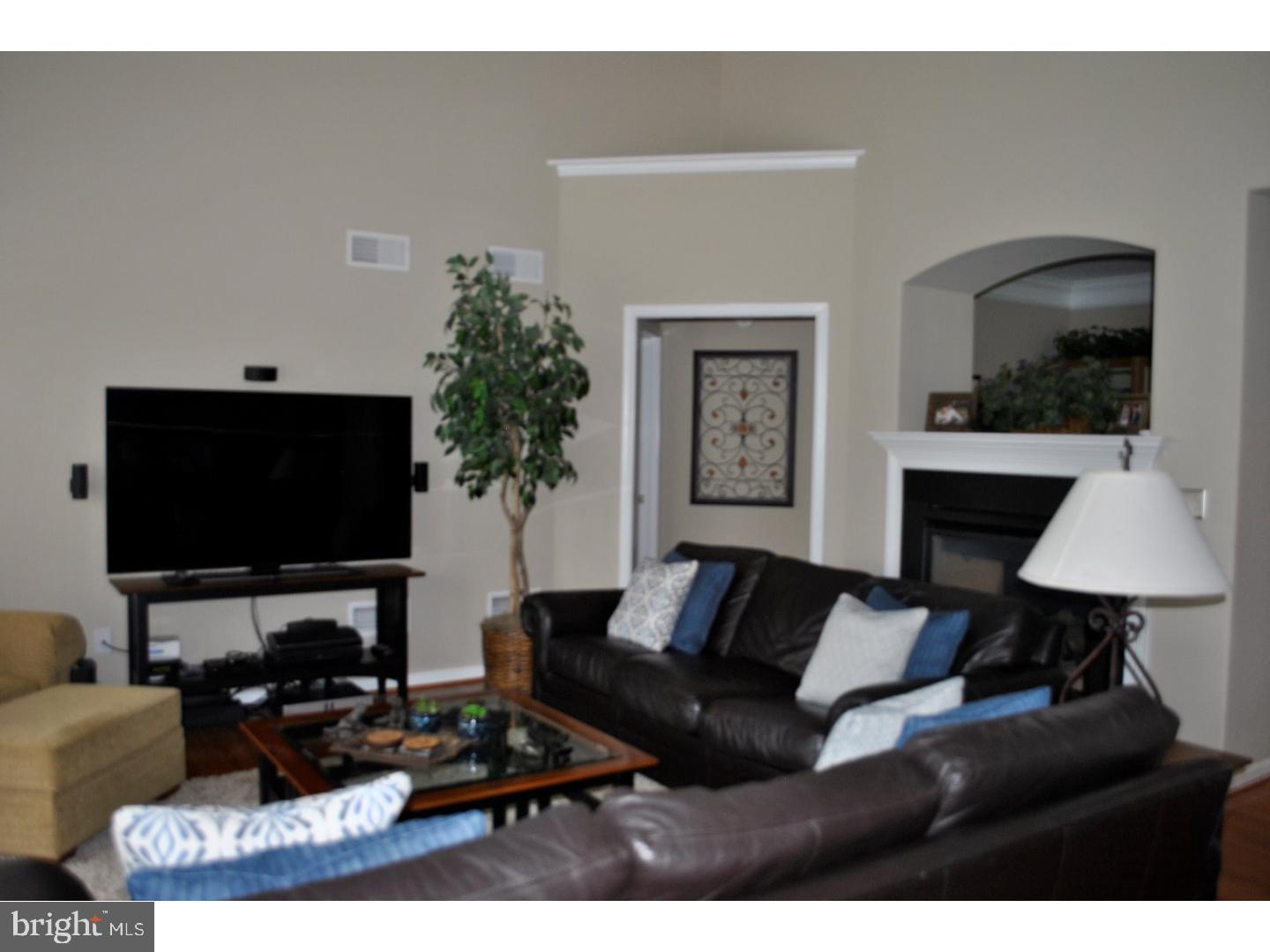 104 Hollins Road Landenberg, PA 19350 - Photo 6 of 17 a living room with furniture and a flat screen tv