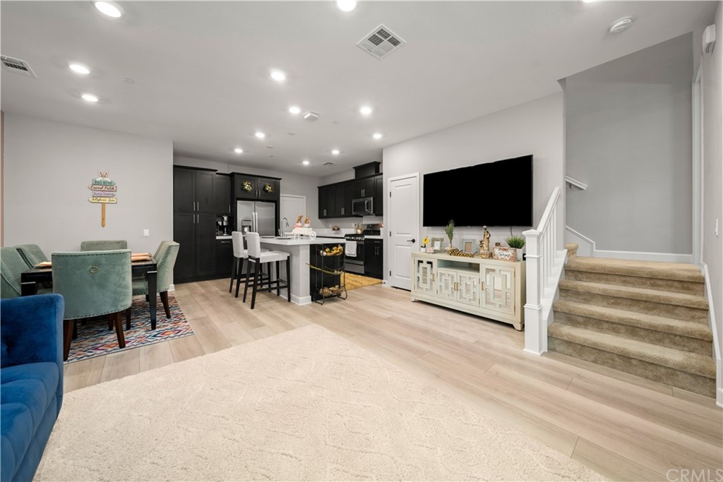 1073 Delpy View Point Vista, CA 92084 - Photo 1 of 1 a living room with furniture and a flat screen tv