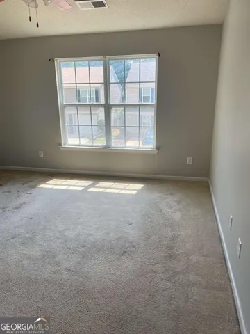 an empty room with a fireplace