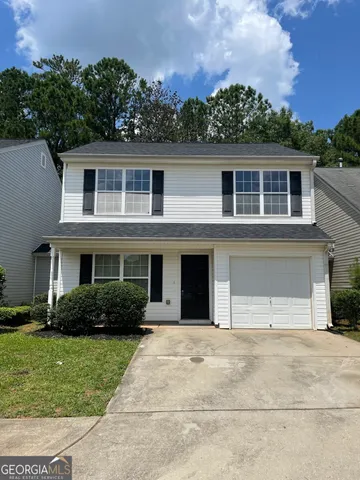 a house view with a garden space