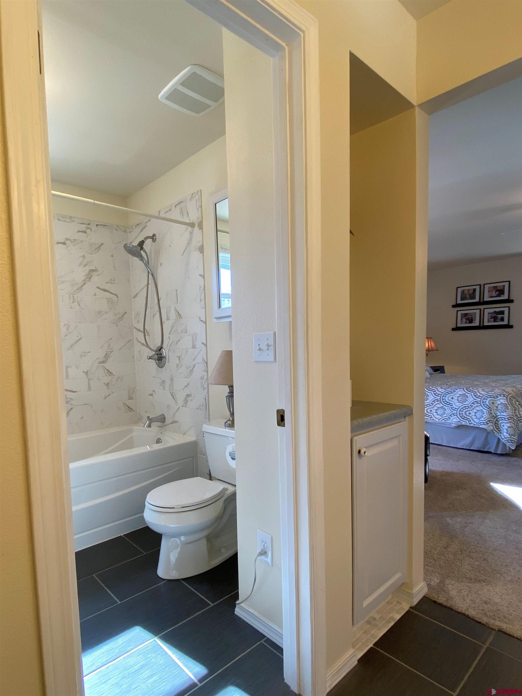 84 Ridge Road Durango, CO 81303 - Photo 15 of 33 a bathroom with a toilet a sink and a shower