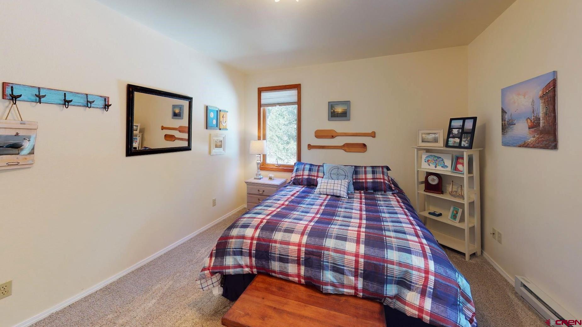 84 Ridge Road Durango, CO 81303 - Photo 19 of 33 a bedroom with a bed and dresser