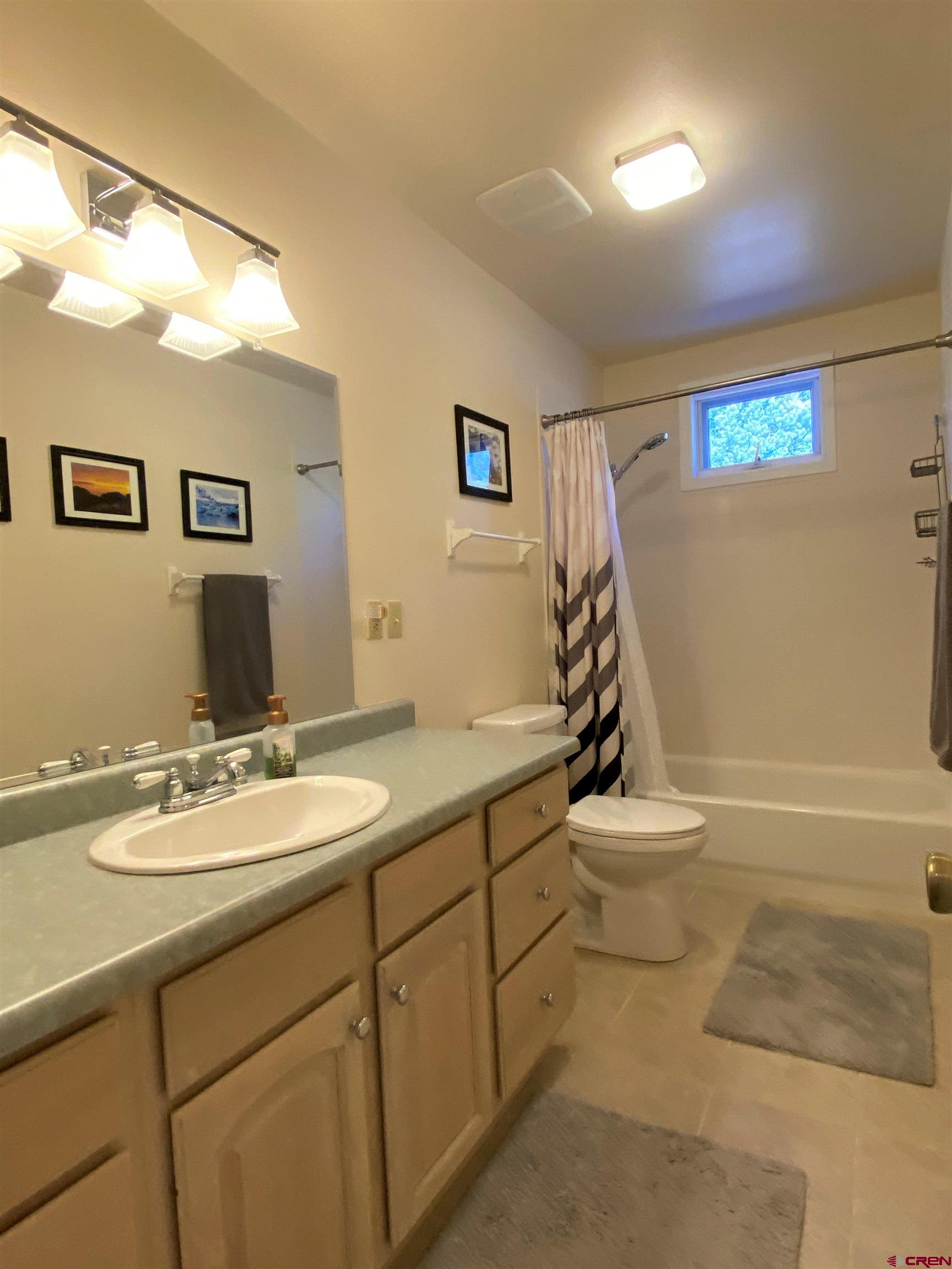 84 Ridge Road Durango, CO 81303 - Photo 20 of 33 a bathroom with a sink a toilet and mirror