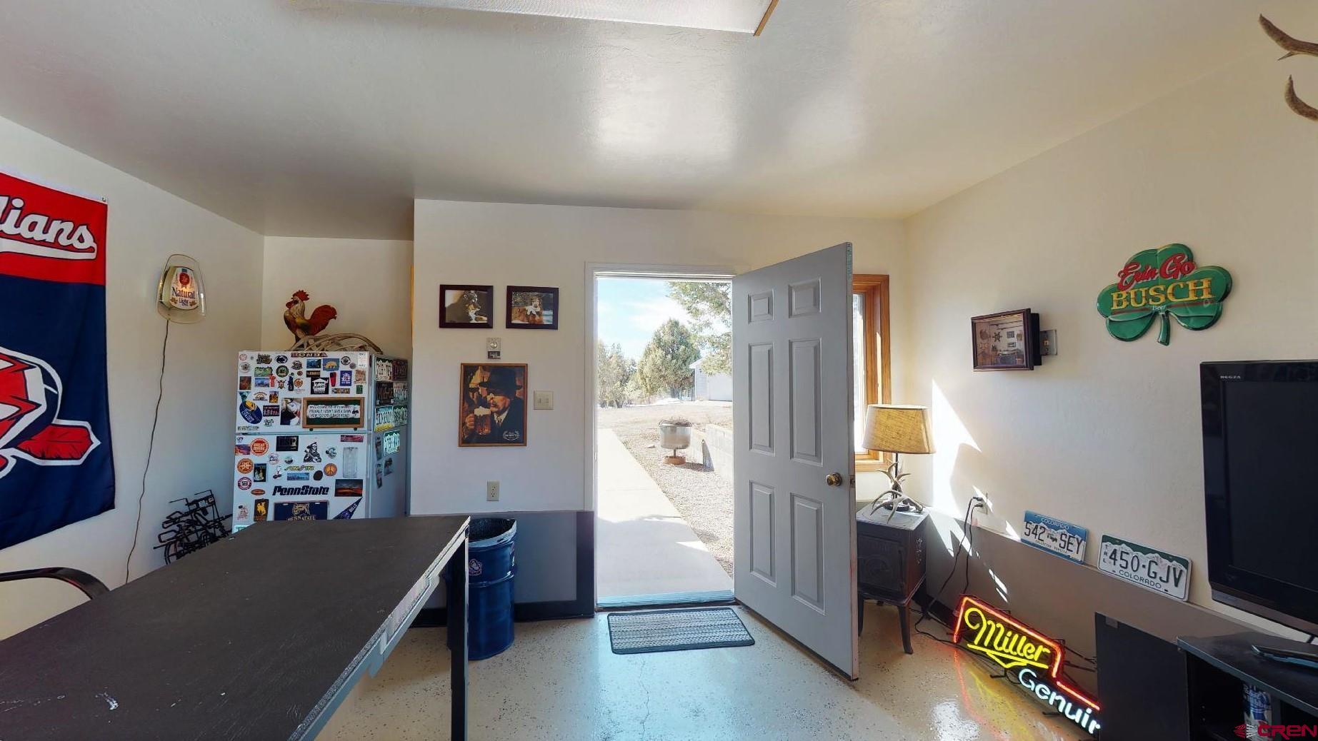 84 Ridge Road Durango, CO 81303 - Photo 27 of 33 a living room with furniture and a flat screen tv