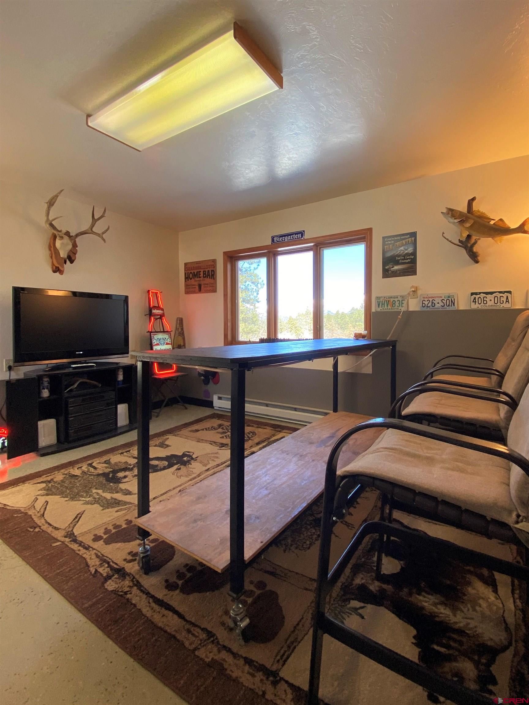 84 Ridge Road Durango, CO 81303 - Photo 28 of 33 a bedroom with a bed and a flat screen tv