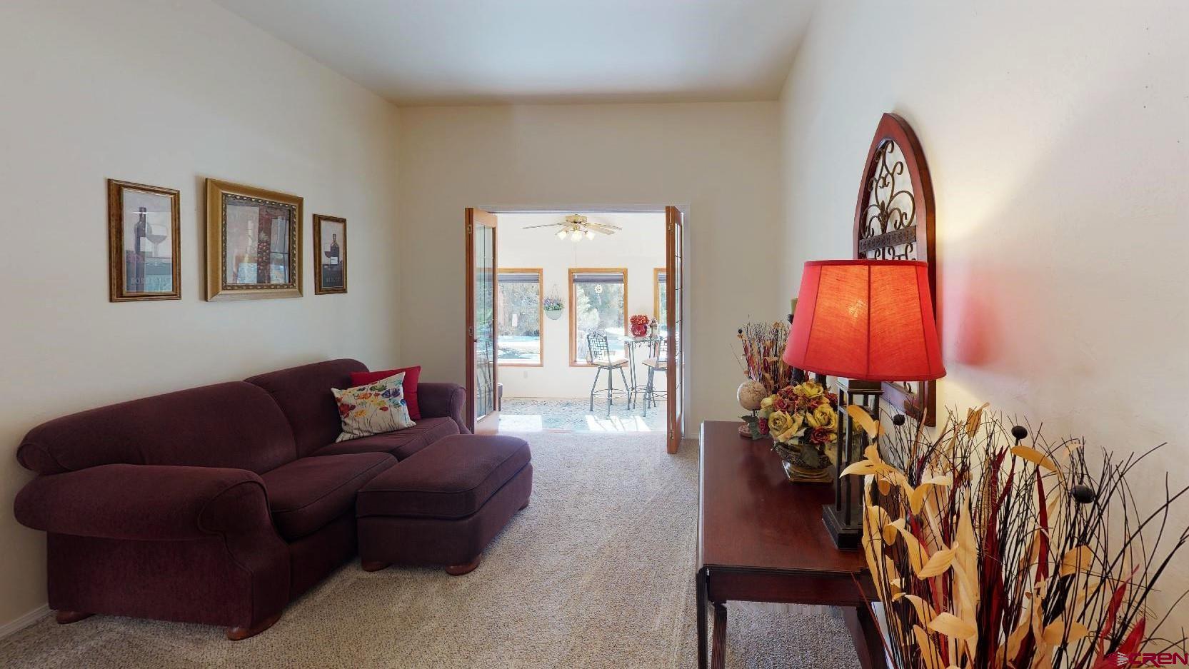 84 Ridge Road Durango, CO 81303 - Photo 4 of 33 a living room with furniture a lamp and a potted plant