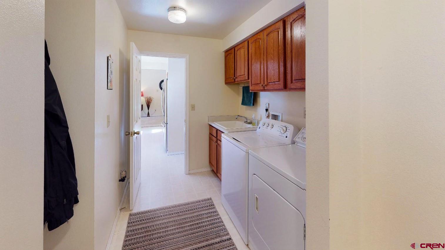 84 Ridge Road Durango, CO 81303 - Photo 10 of 33 a kitchen with a sink and refrigerator