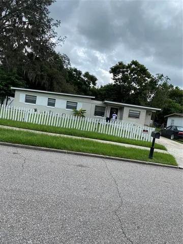 a view of backyard with green space