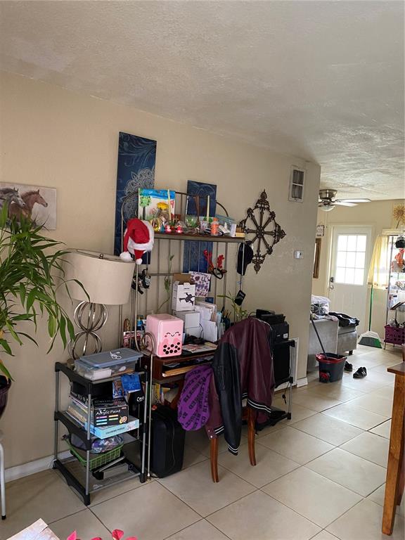 4207 Meadowbrook Avenue Orlando, FL 32808 - Photo 4 of 13 a living room with furniture and a couch