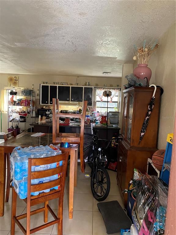 4207 Meadowbrook Avenue Orlando, FL 32808 - Photo 5 of 13 a view of a room with gym equipment