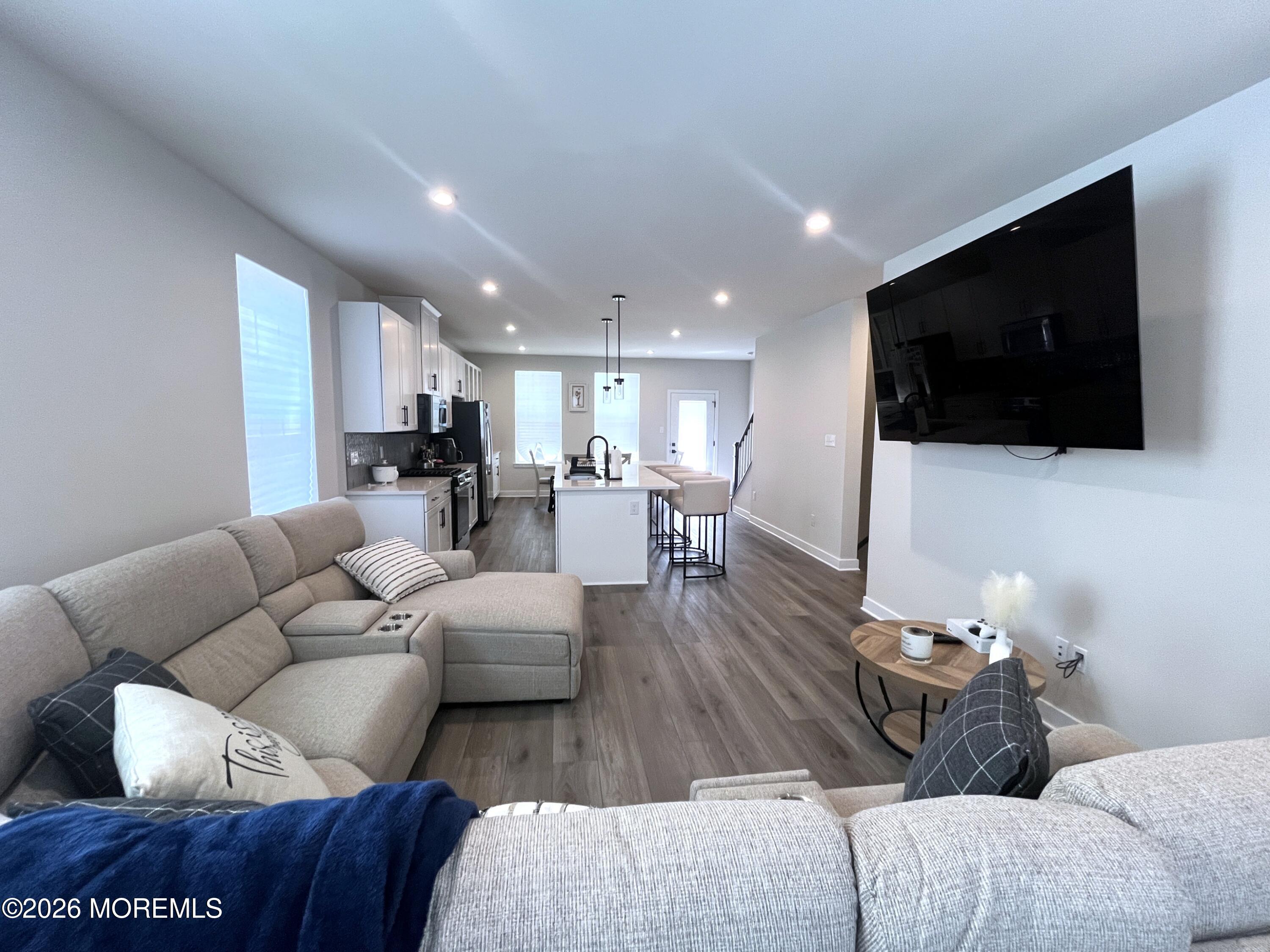 1 Halifax Road, Unit 1 Bayville, NJ 08721 - Photo 12 of 22 a living room with furniture and a flat screen tv