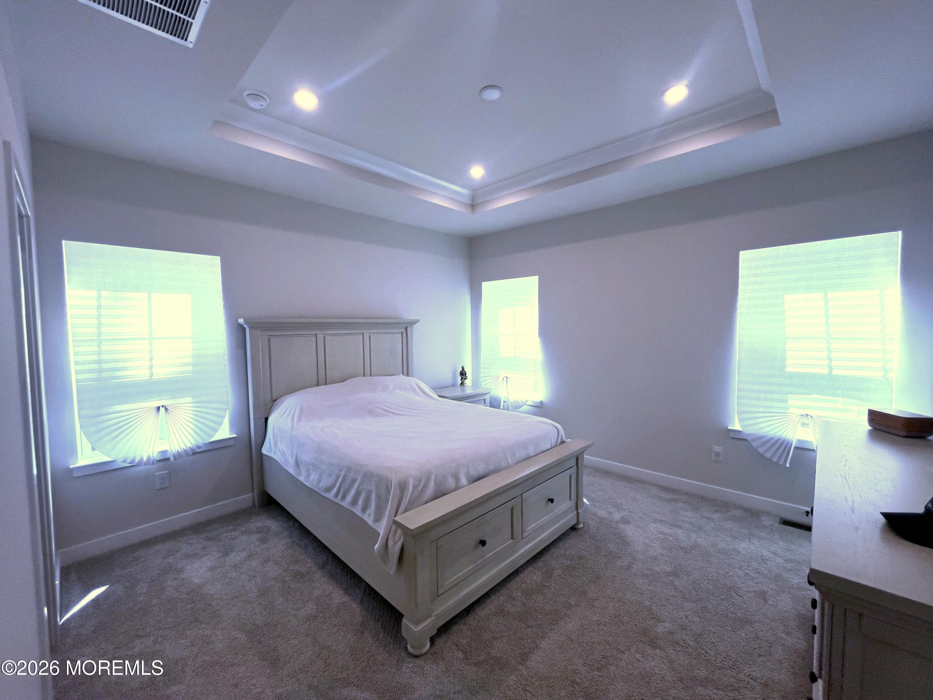 1 Halifax Road, Unit 1 Bayville, NJ 08721 - Photo 16 of 22 a spacious bedroom with a bed and a table