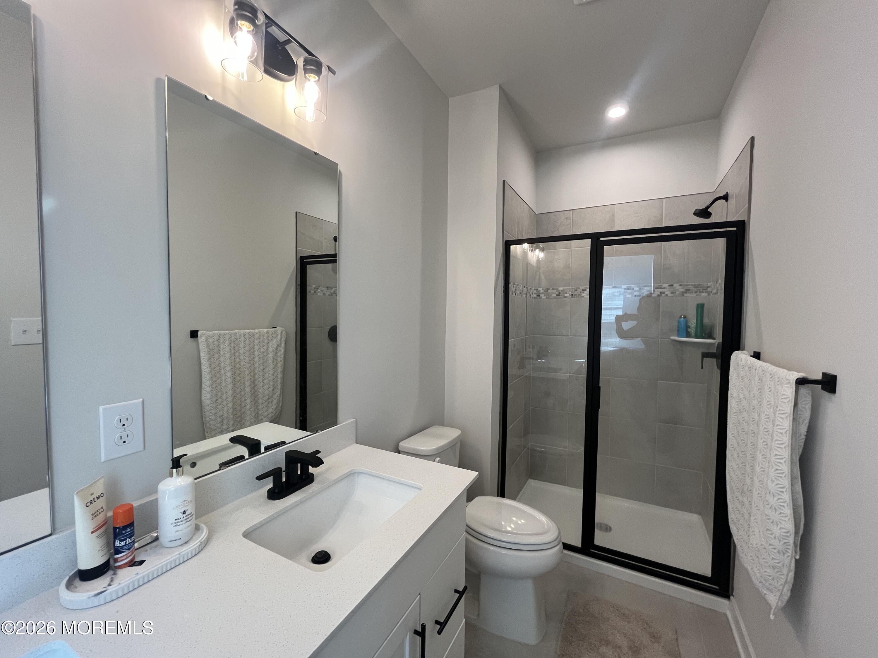 1 Halifax Road, Unit 1 Bayville, NJ 08721 - Photo 18 of 22 a bathroom with a sink toilet and shower