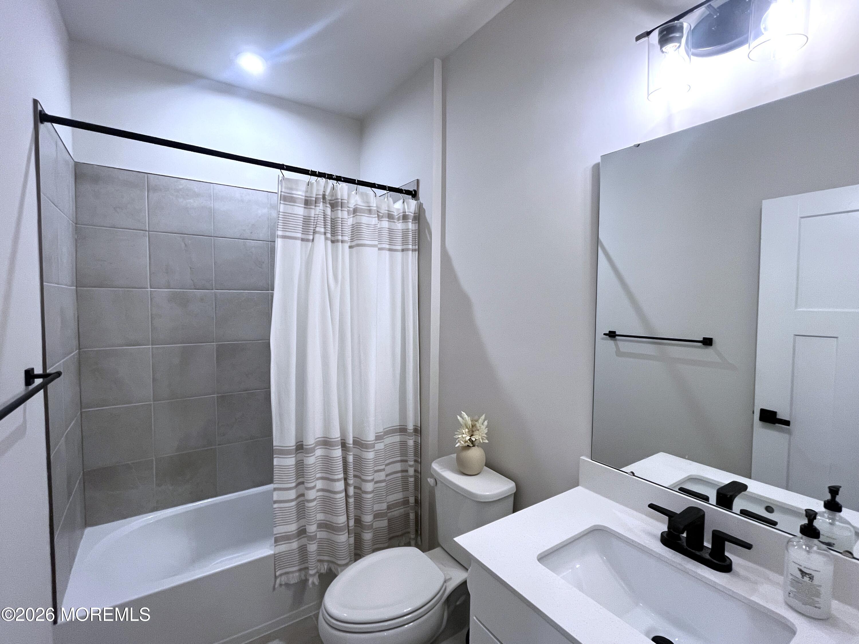 1 Halifax Road, Unit 1 Bayville, NJ 08721 - Photo 21 of 22 a bathroom with a sink toilet and shower