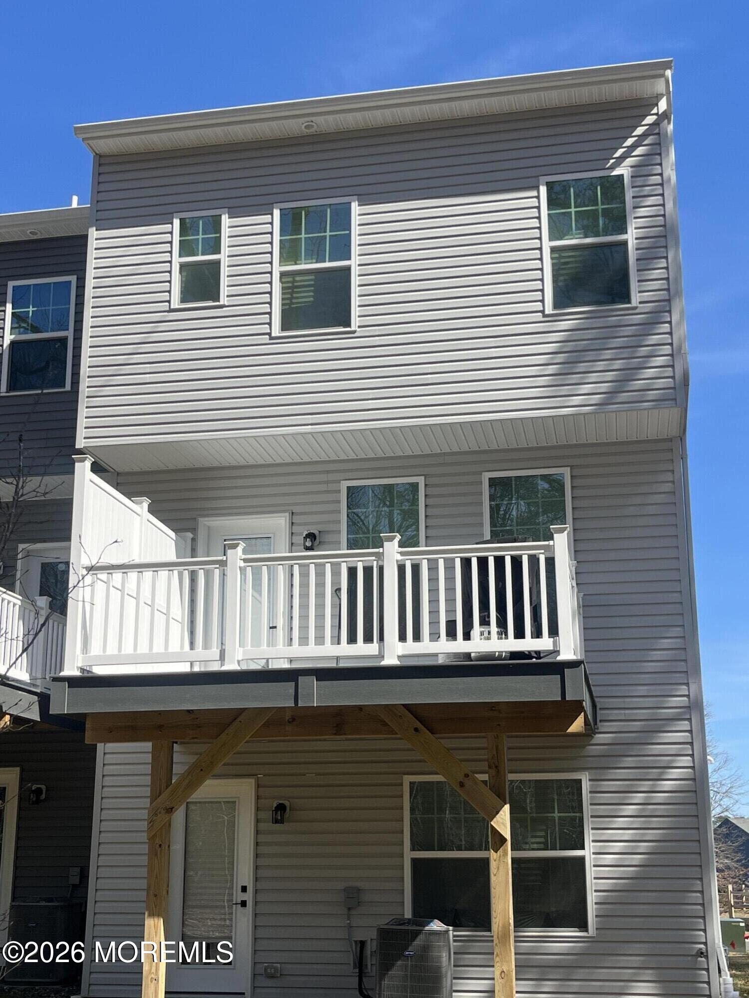 1 Halifax Road, Unit 1 Bayville, NJ 08721 - Photo 5 of 22 a front view of a house with balcony