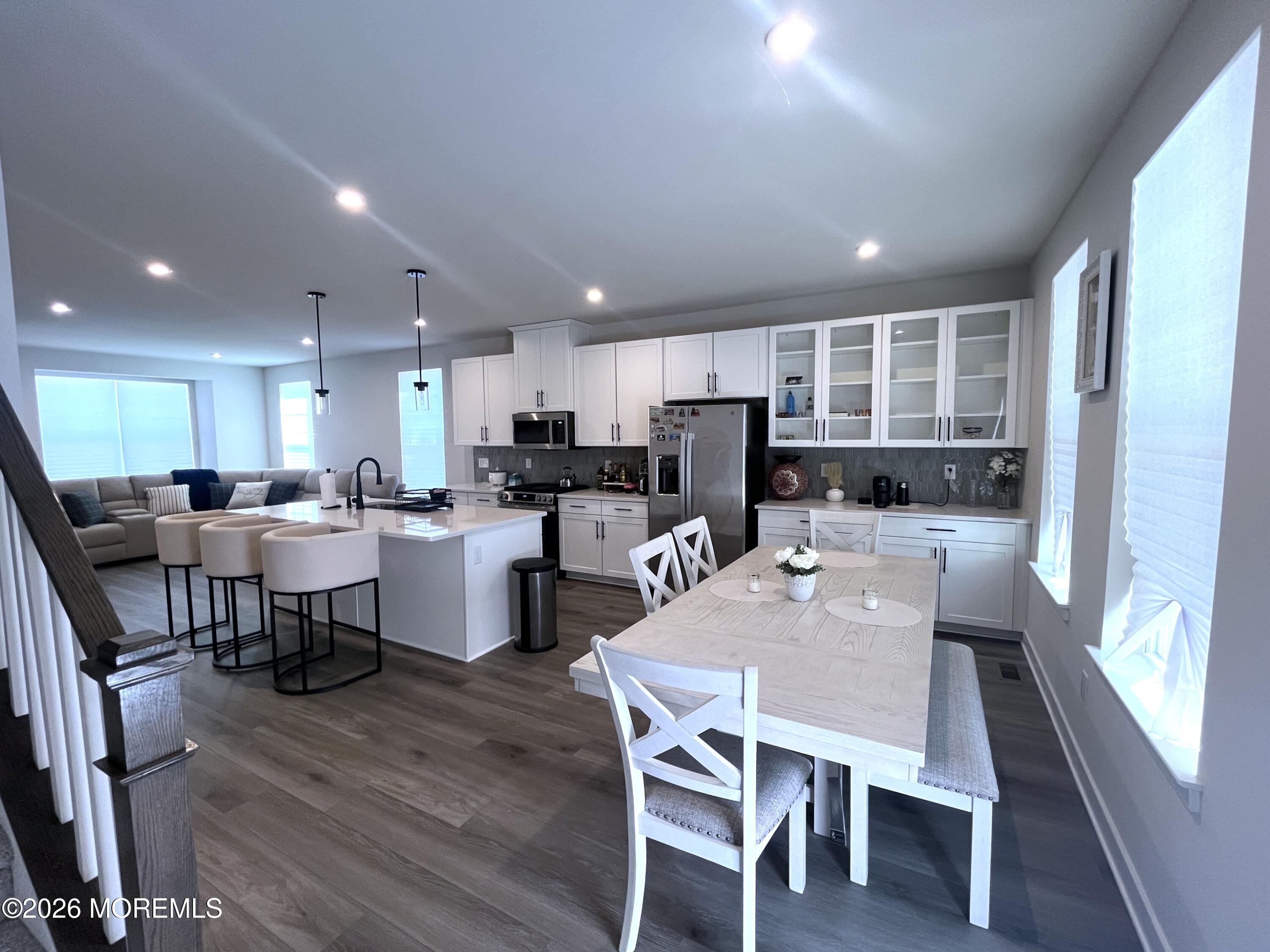 1 Halifax Road, Unit 1 Bayville, NJ 08721 - Photo 10 of 22 a view of a dining room with furniture a rug and wooden floor