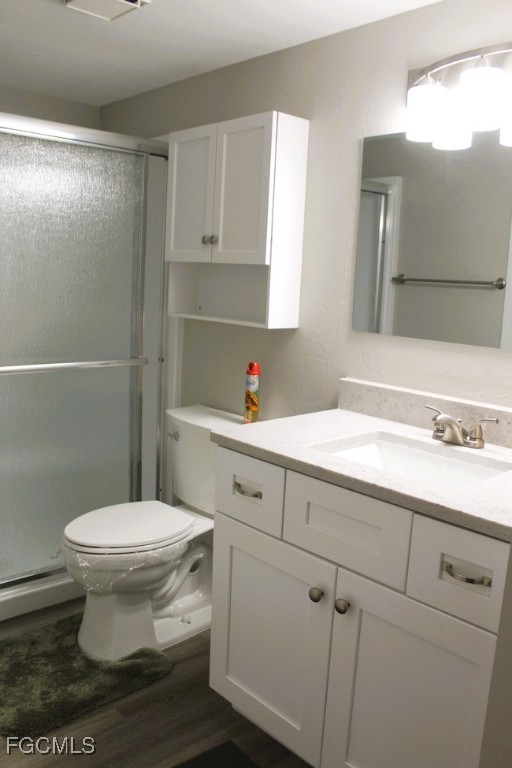 16881 Davis Road, Unit 112 Fort Myers, FL 33908 - Photo 12 of 15 a bathroom with a sink a toilet and mirror