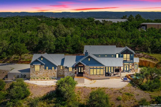 a view of swimming pool with seating area