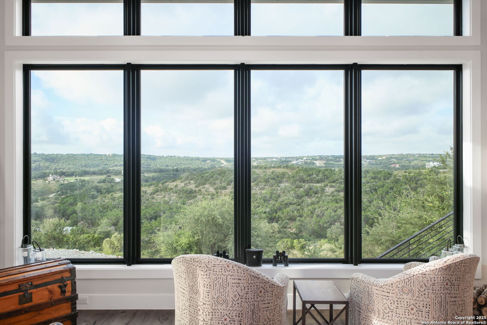 1023 Comanche Ridge New Braunfels, TX 78132 - Photo 12 of 109 a view of a room with a large window and a couch
