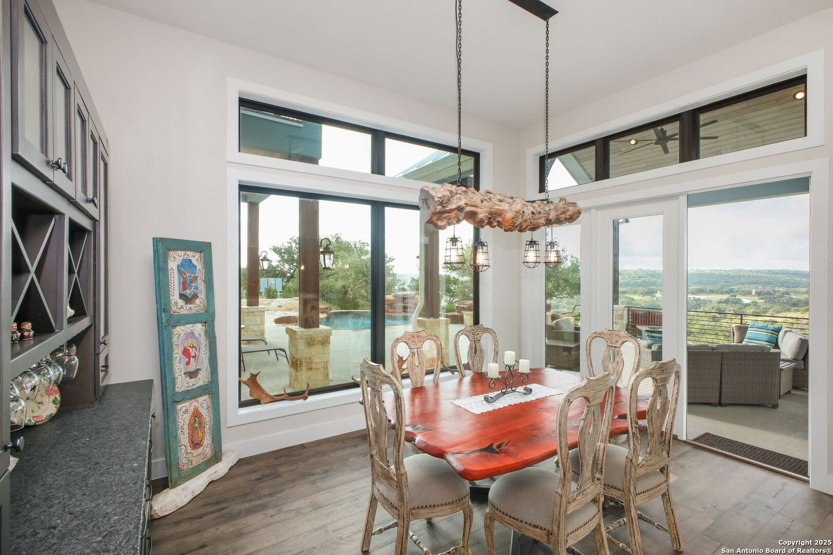 1023 Comanche Ridge New Braunfels, TX 78132 - Photo 22 of 109 a dining room with furniture water view and a large window